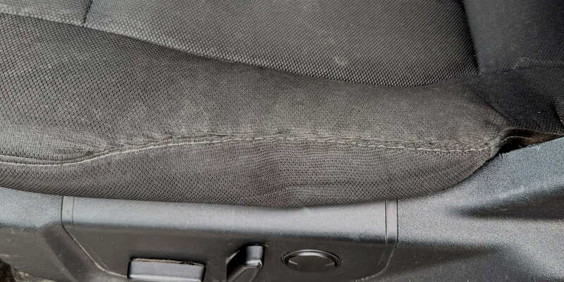After: fabric seat tear repaired seamlessly