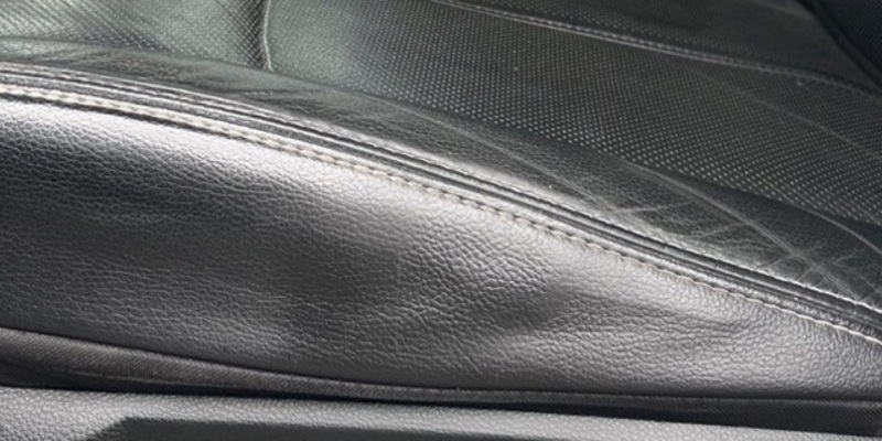 After: leather seat bolster repaired seamlessly