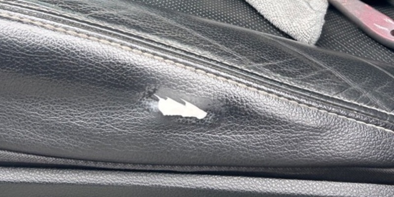 Before: cut leather seat bolster with foam exposed